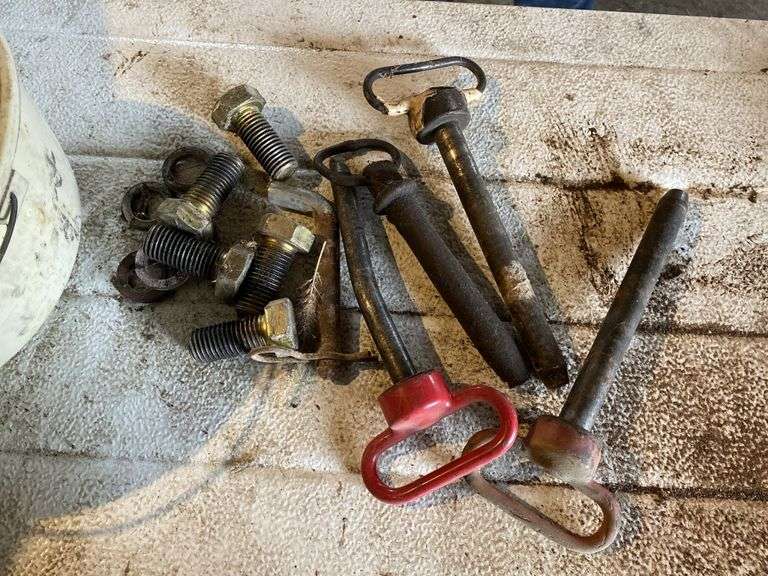 Assorted hitch, pins, and bolts Legacy Auction Company