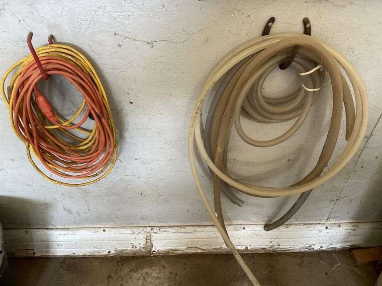 Two drop cords and plastic tubing Legacy Auction Company
