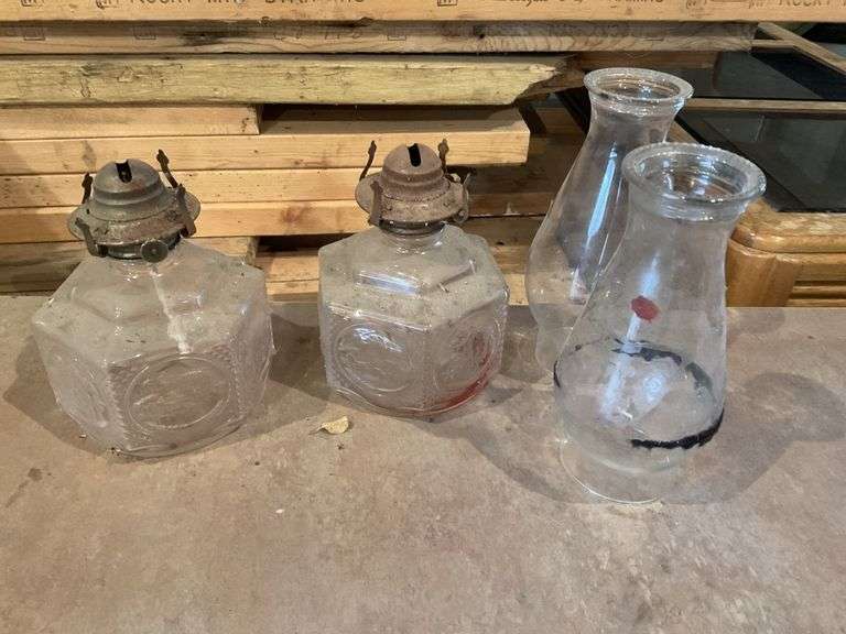 Two oil lamp bases & chimneys Legacy Auction Company