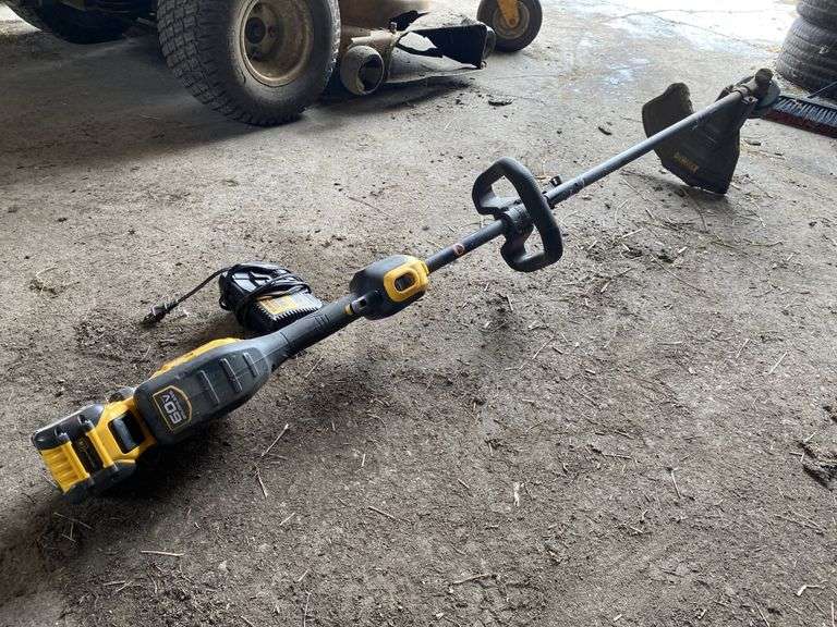 DeWalt 60V string trimmer, battery and charger. Legacy Auction Company