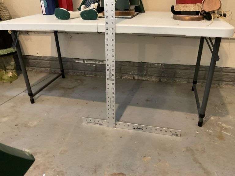 2 foot 4’ x 2’ table only . Adjustable legs - Legacy Auction Company