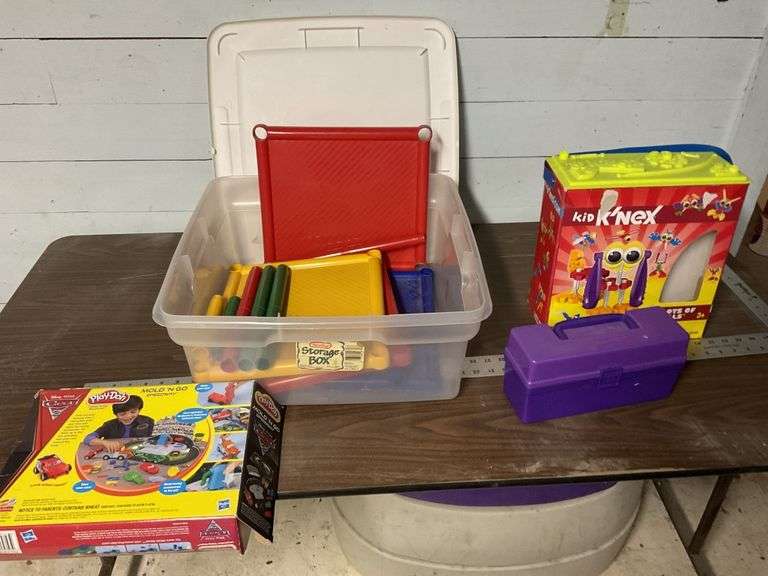 Shelving unit and kids games with tote Legacy Auction Company