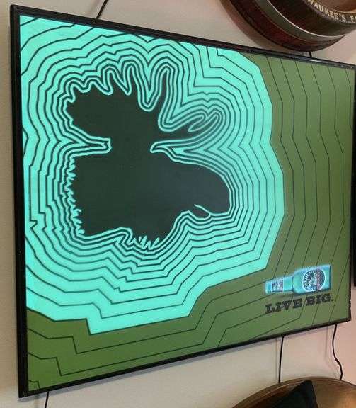 The Moosehead “live big” motion sign Legacy Auction Company