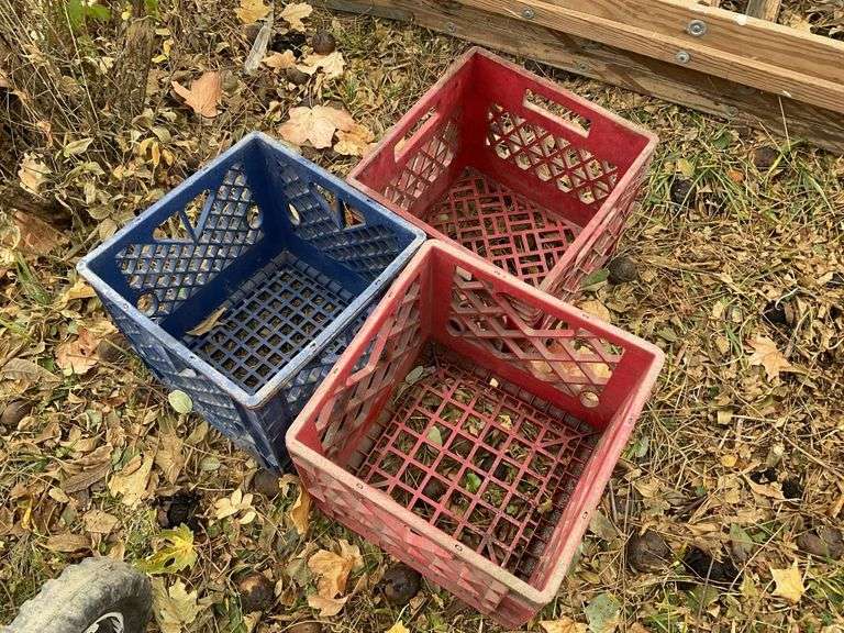 Three plastic milk crates Legacy Auction Company
