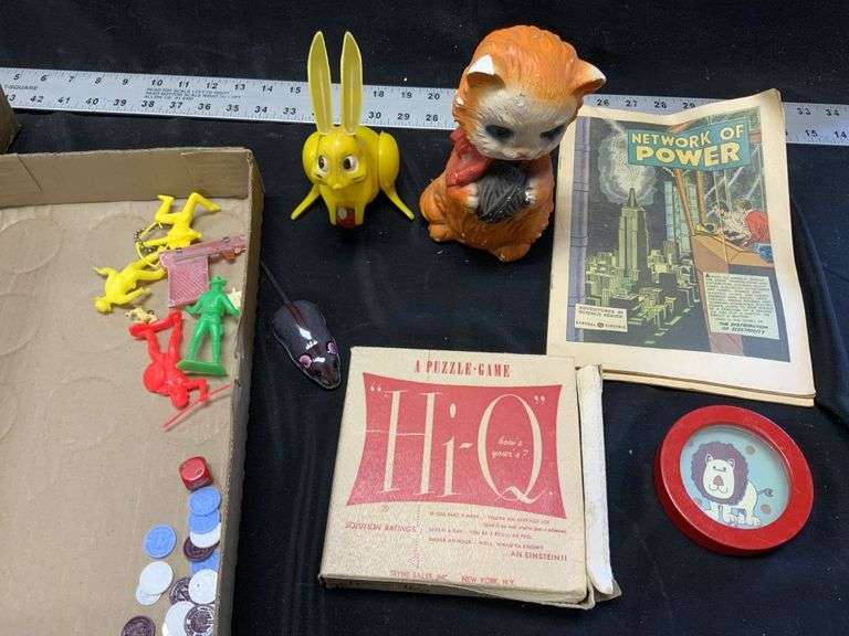 Vintage toys, comics, cat has chipped ears Legacy Auction Company