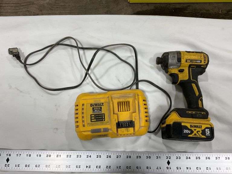 Dewalt 20 V quarter inch impact driver with Legacy Auction Company