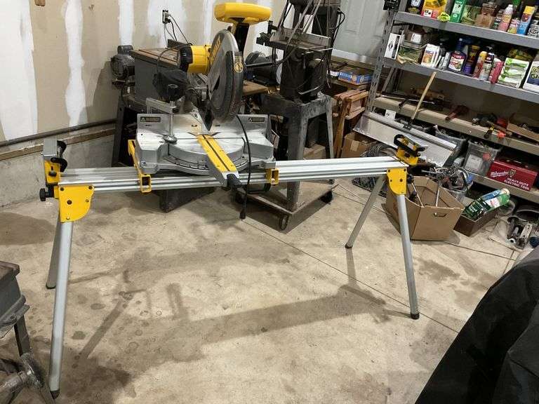 12” Dewalt compound miter Saw and stand Legacy Auction Company