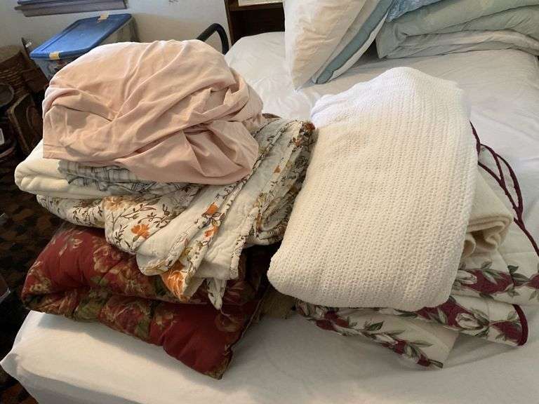 Assorted sheets and blankets Legacy Auction Company