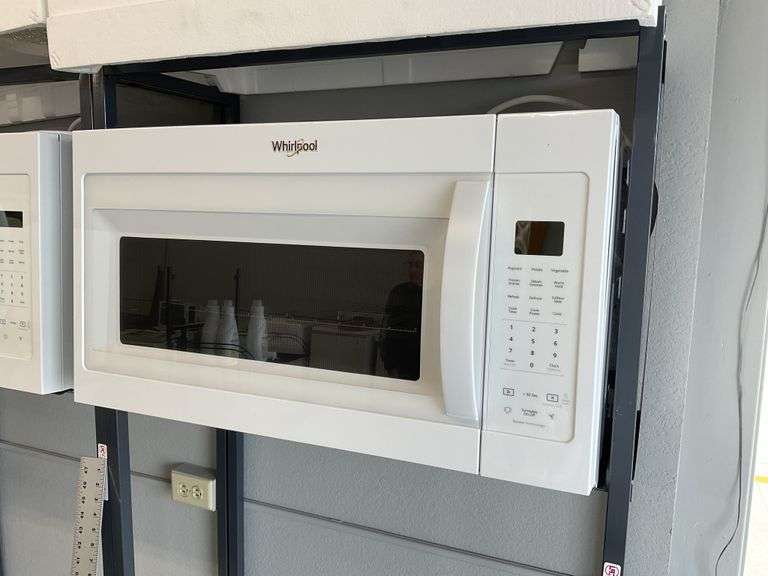 Whirlpool over the range microwave. With Legacy Auction Company