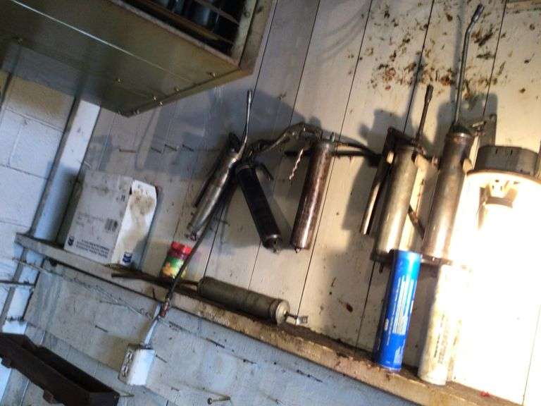 Grease guns and full case of grease Legacy Auction Company