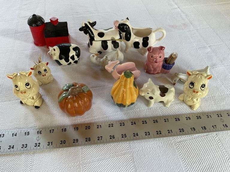 Salt and pepper and creamers Legacy Auction Company