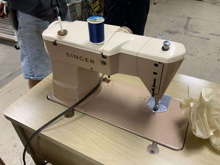 Vintage Singer sewing machine and seat Legacy Auction Company