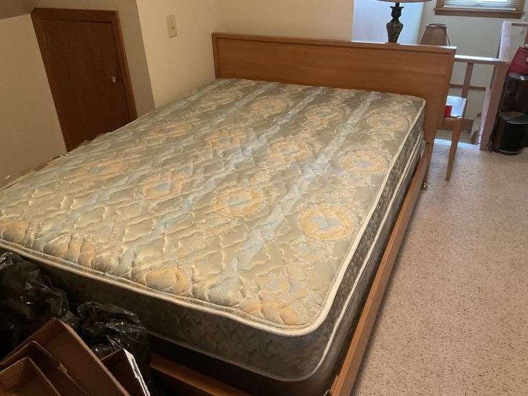 Full size bed and mattress. Buyer removes from Legacy Auction Company