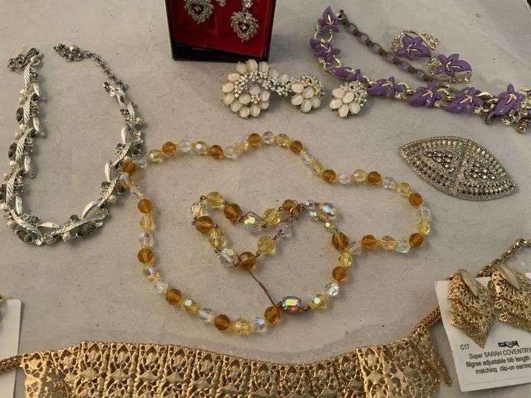 Vintage jewelry sets, some are marked Legacy Auction Company