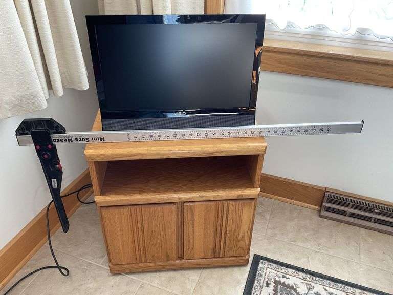 Vizio TV with stand Legacy Auction Company