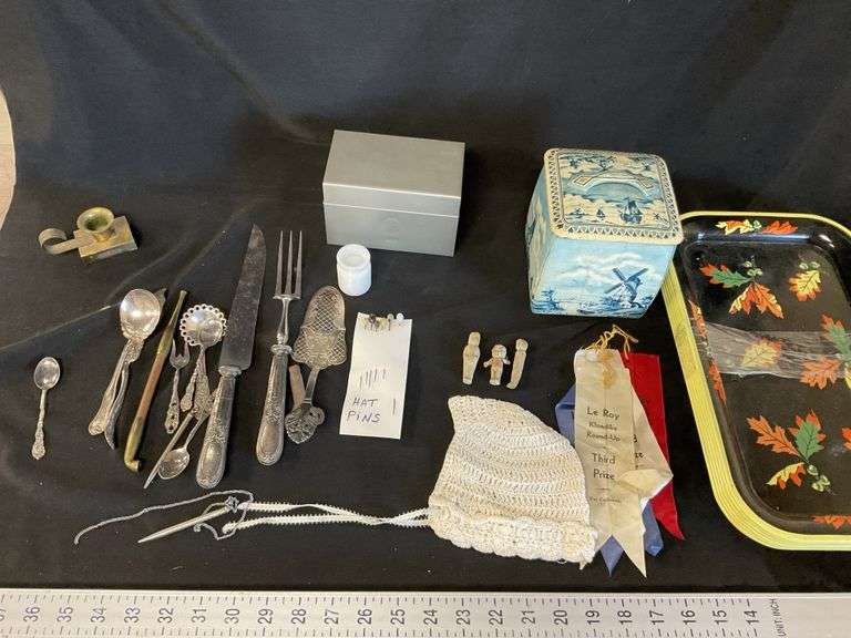 Metal serving trays, canister, utensils etc. Legacy Auction Company