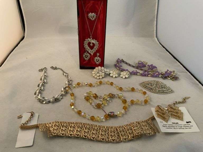 Vintage jewelry sets, some are marked Legacy Auction Company