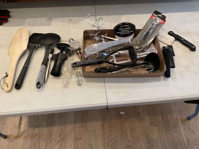 Kitchen utensils, wine bottle corks and Legacy Auction Company