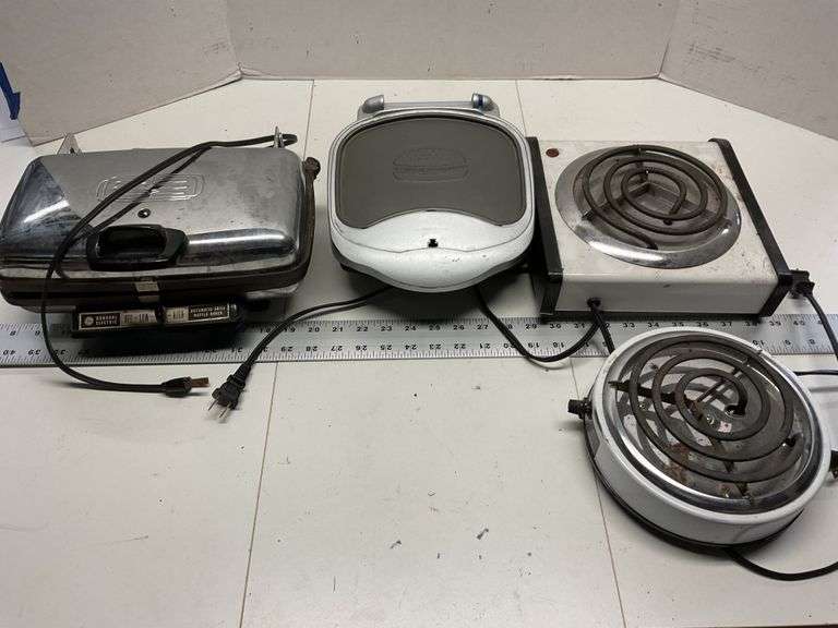 GE waffle maker, bun warmer and two hot plates Legacy Auction Company