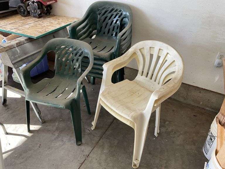 8 plastic patio chairs Legacy Auction Company