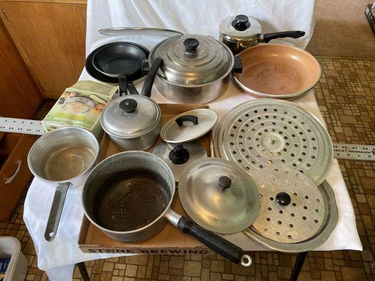 Assorted pots and pans Legacy Auction Company