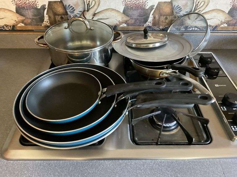 Assorted cooking pans Legacy Auction Company