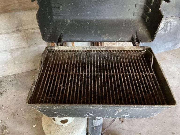 Gas grill. LP tank half full Legacy Auction Company