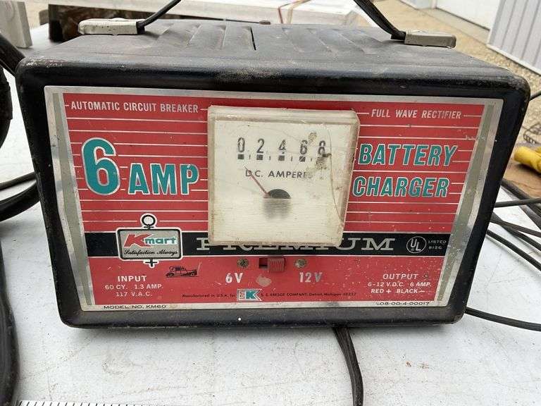 Kmart battery charger and one set of jumper cables Legacy Auction Company