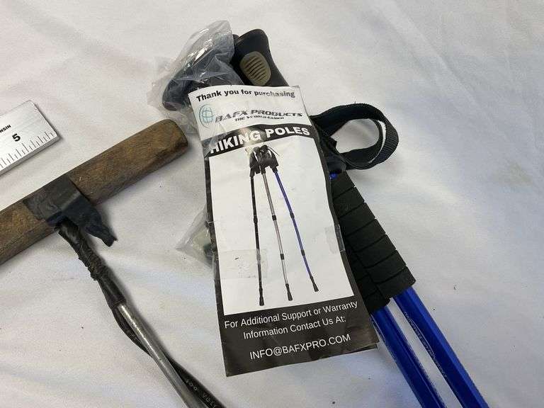 Hiking poles and electric worm rod Legacy Auction Company