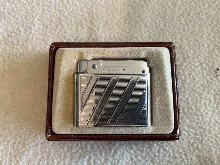 Vintage Schick butane lighter, stuck Legacy Auction Company