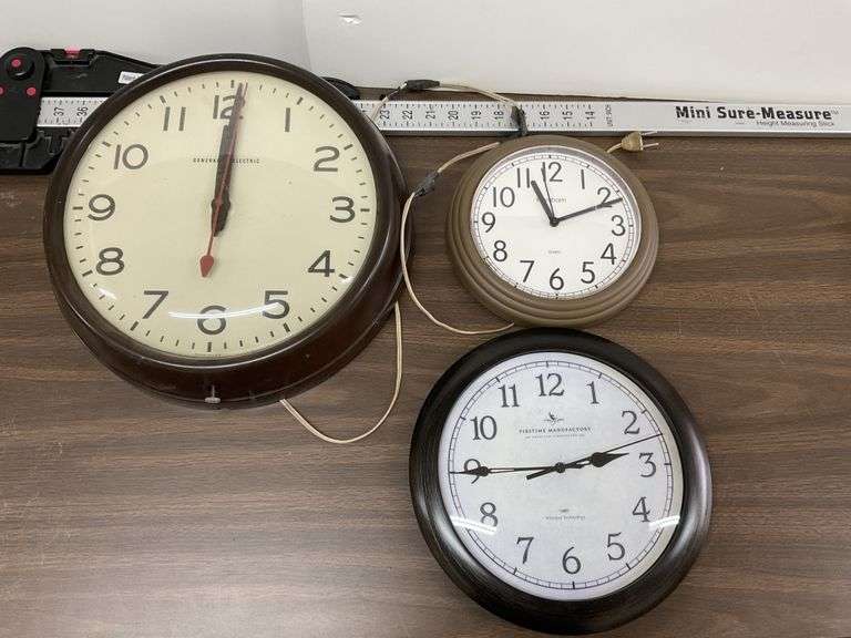 Wall clocks. GE clock cord has been repaired Legacy Auction Company