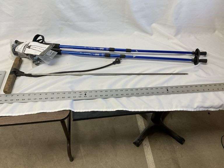 Hiking poles and electric worm rod Legacy Auction Company