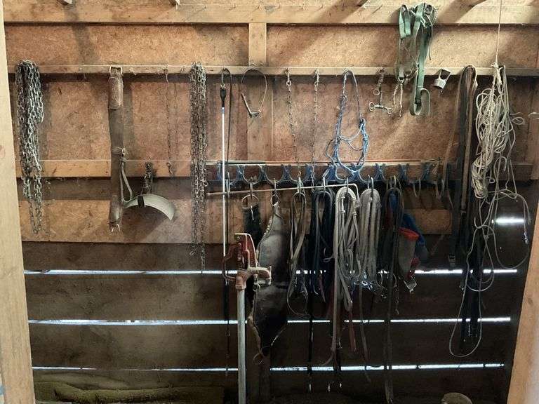 Saddle, Racks, Tack ,buckets, Etc. In Tack Room Legacy Auction Company