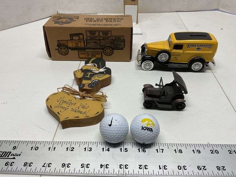 Iowa Hawkeyes bank, golf balls, etc Legacy Auction Company