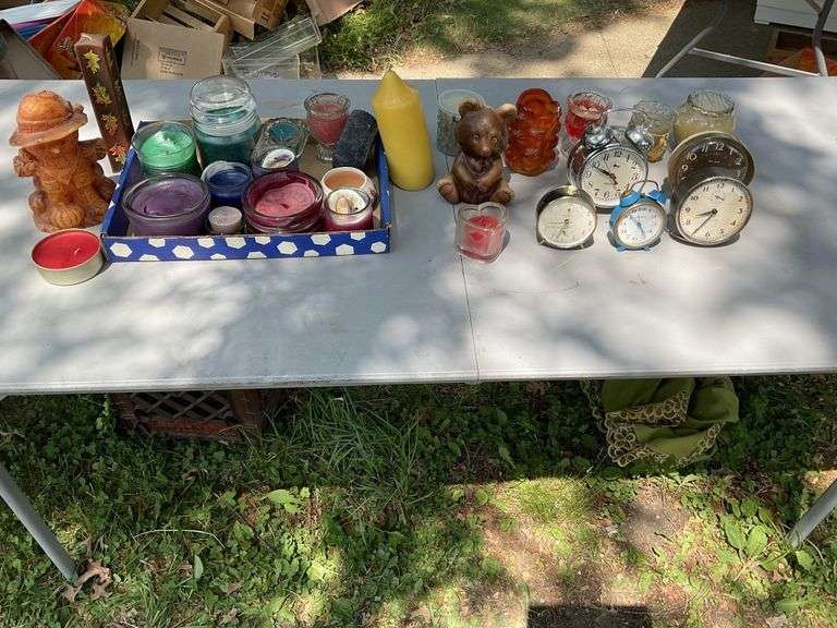 Candles, alarm clocks Legacy Auction Company