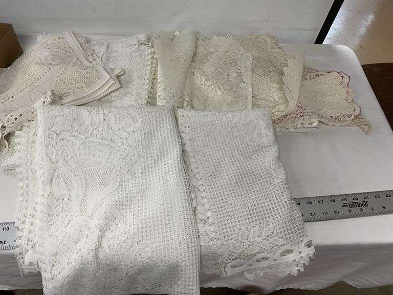Lace tablecloths, etc. Legacy Auction Company