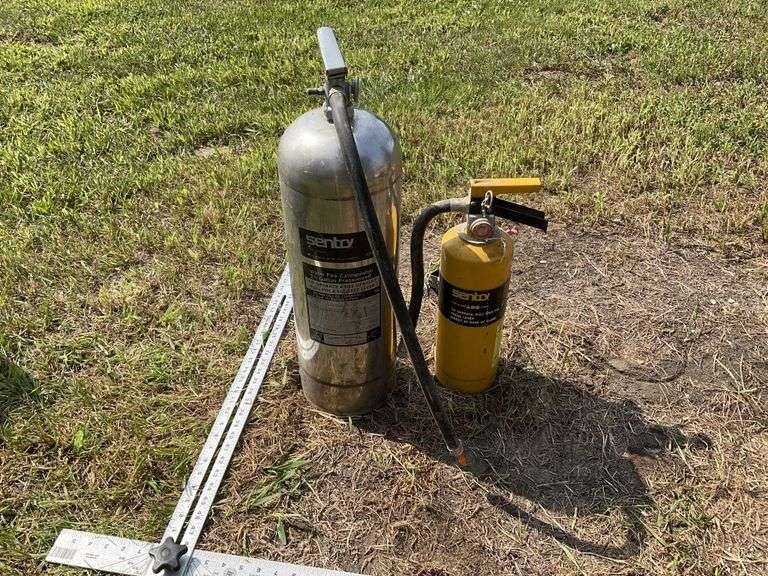 Two Sentry fire extinguishers Legacy Auction Company