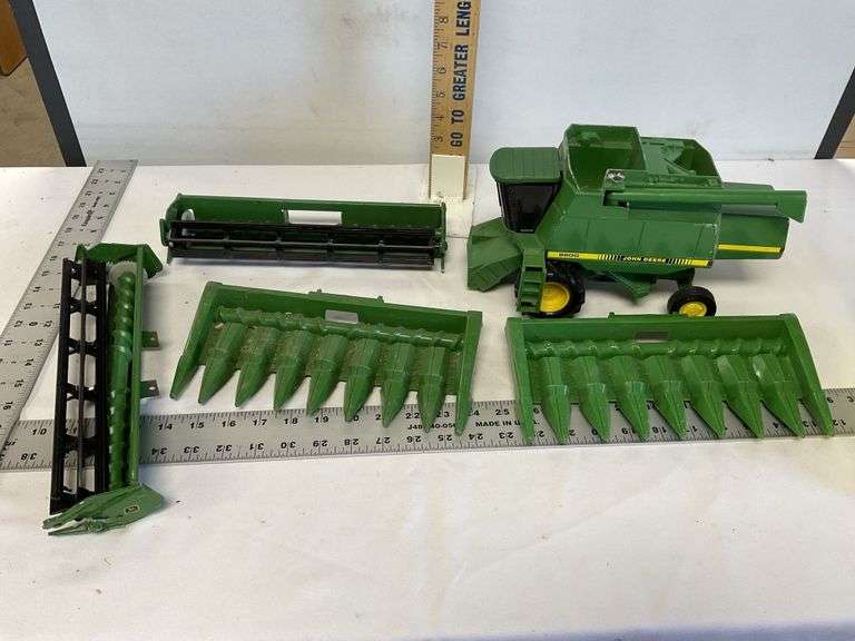 John Deere combine, attachments Legacy Auction Company
