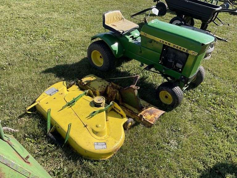 John Deere 70 lawn tractor with 42” blade and Legacy Auction Company