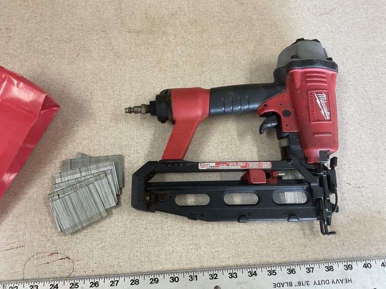 Milwaukee 16 gauge finish nailer with nails Legacy Auction Company