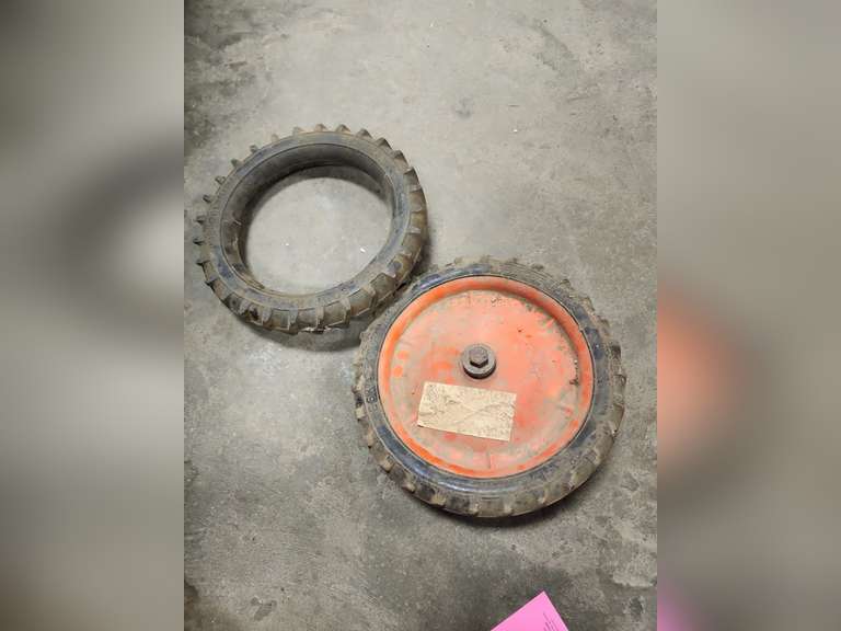 2 pedal tractor tires (1 w/ wheel) Lindsay Auctions & Realty LLC