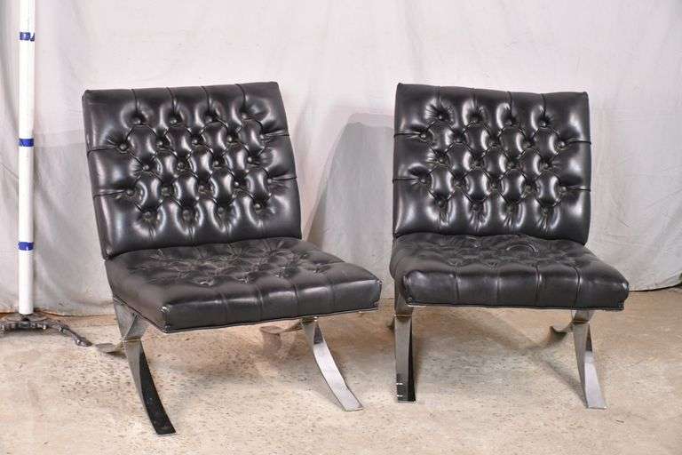 Pair of black tufted vinyl accent chairs with chrome bases; 558644 R