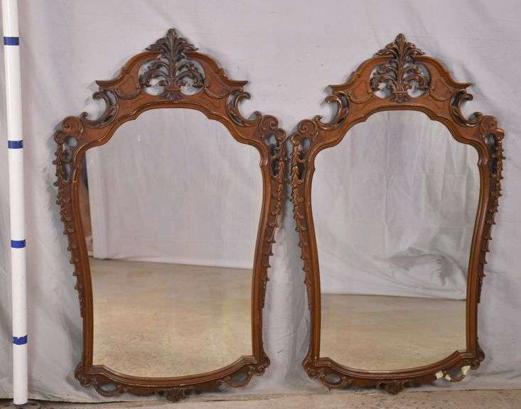 Pair of mirrors with ornate carved walnut frames; 558061E R.H. Lee