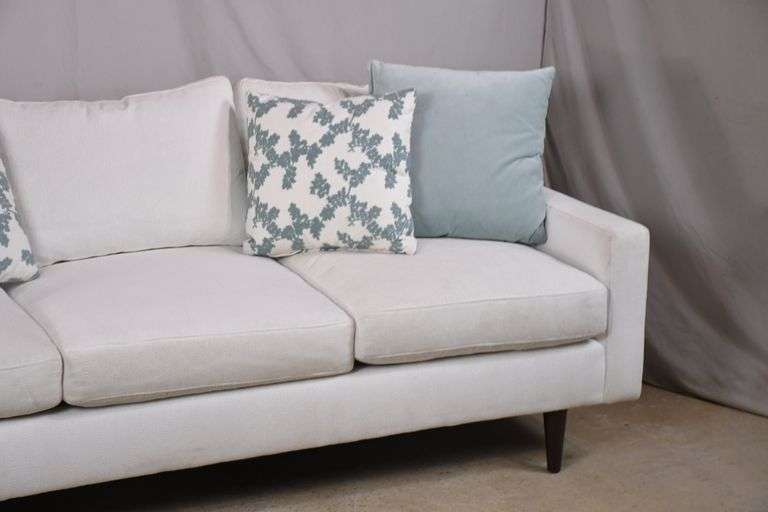 Universal "Brentwood" white upholstered modern style sofa with 4 accent