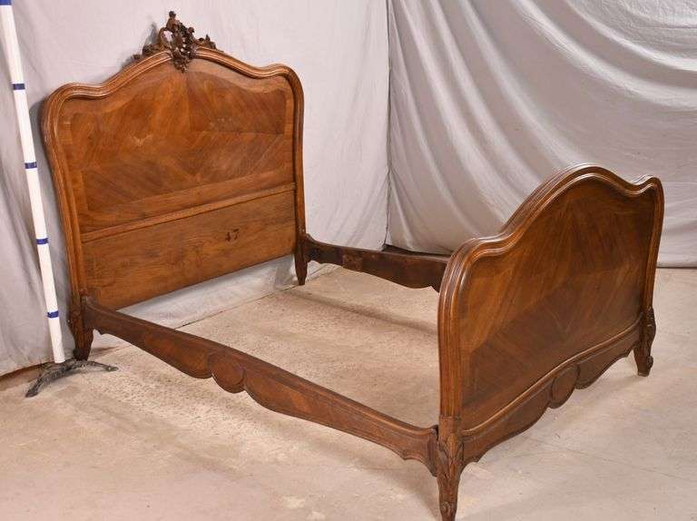 Carved walnut French style full size bed with bolton rails; 371157