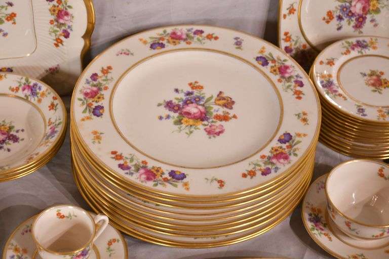 55 piece set of Coxon Belleek china with floral pattern and gold trim