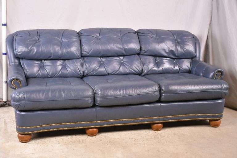 Thomasville blue tufted leather sofa with brass nail head trim; 371907