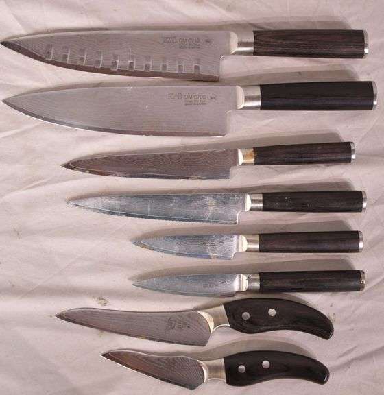 Group of 8 KAI knives with Damascus steel blades; 13881M036 R.H. Lee