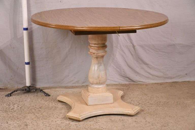 Round formica top dining table with offwhite pedestal base; 1116119