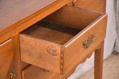 Suter's walnut huntboard with tapered legs; 200-228